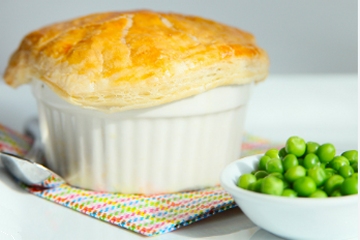 Ramekin of chicken pot pie with thick crust cap